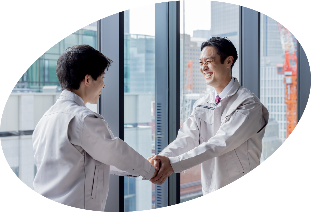 協力会社様との握手